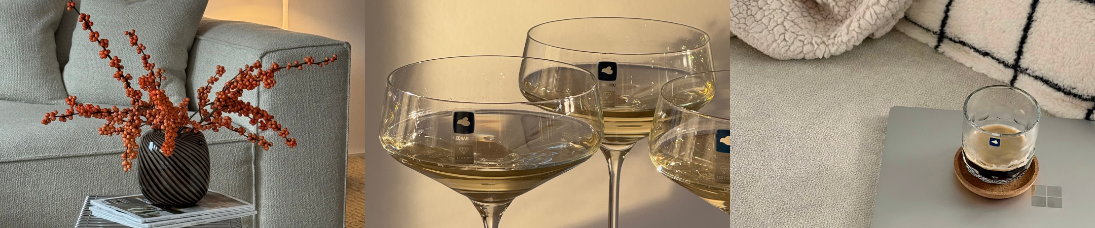 Breites Banner mit Wohnaccessoires: Vase mit roten Beeren auf Beistelltisch, dekorative Bücherkonsole und Schwarz-Weiß-Porträt einer Frau.