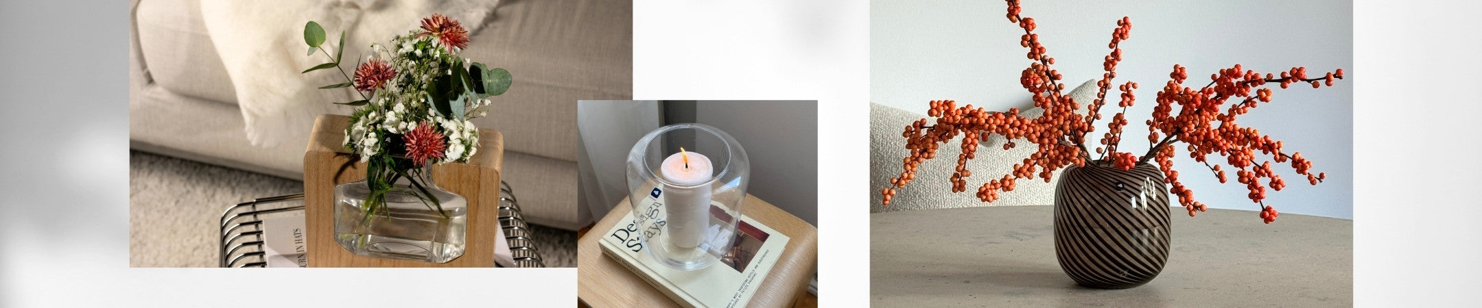 Vasen mit Blumen und Beerenzweigen, Kerzenhalter und kleine Deko-Figuren auf modernem Wohnambiente.
