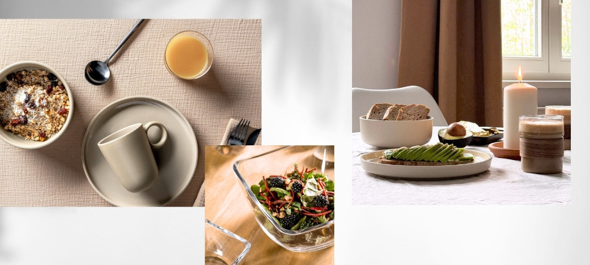 Modern gedeckter Tisch mit Müslischale, Kaffeetasse, Salatschüssel und Avocado-Toast bei Kerzenschein.
